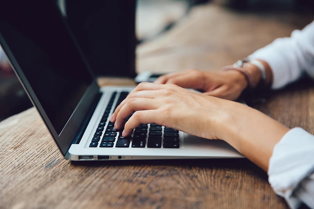 female-hands-typing-keyboard-netbook-close-up-view-business-concept